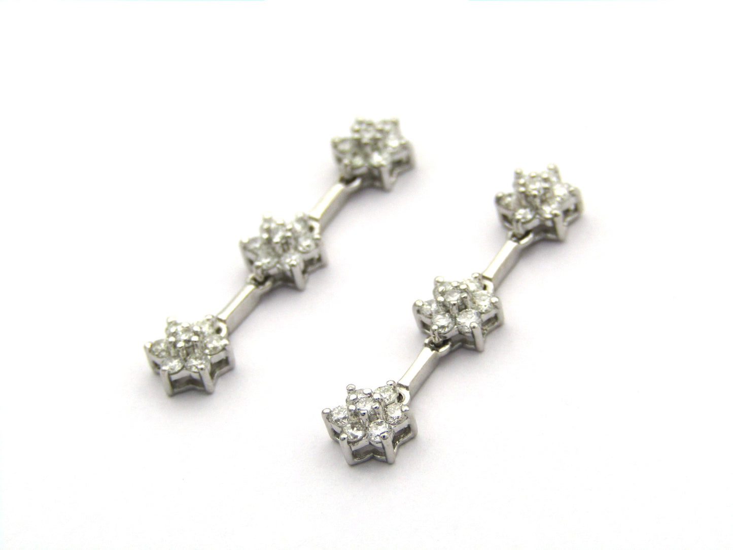 18K gold diamond drop flower earrings by Browns.