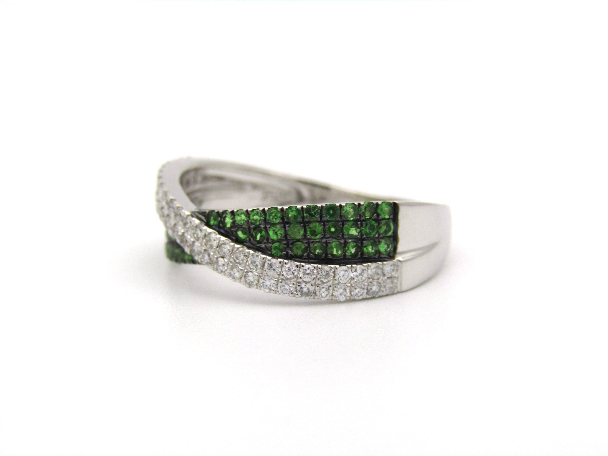 18K gold tsavorite garnet and diamond crossover ring.