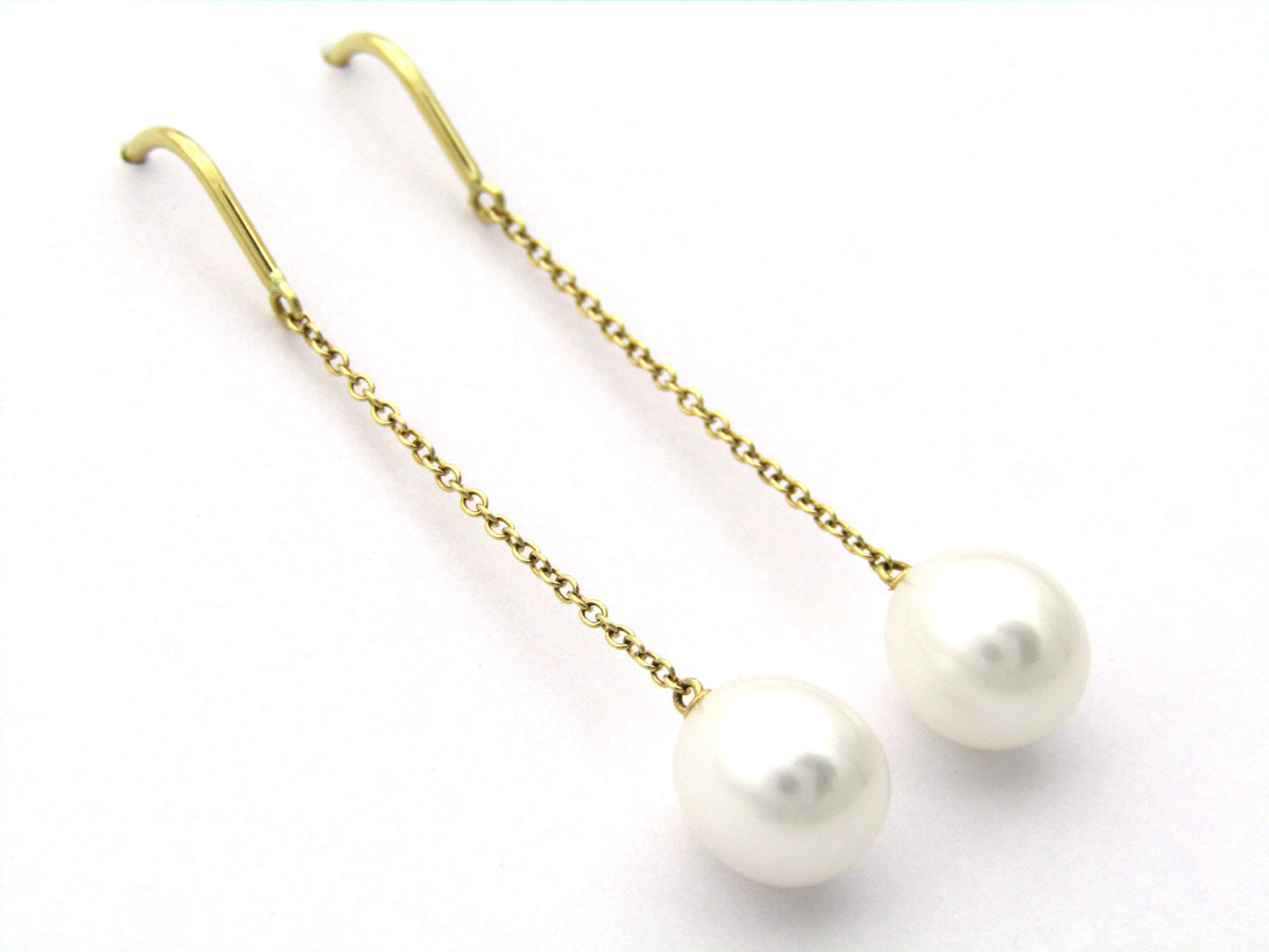 18K gold Tiffany & Co. "Pearls by the Yard" chain earrings.