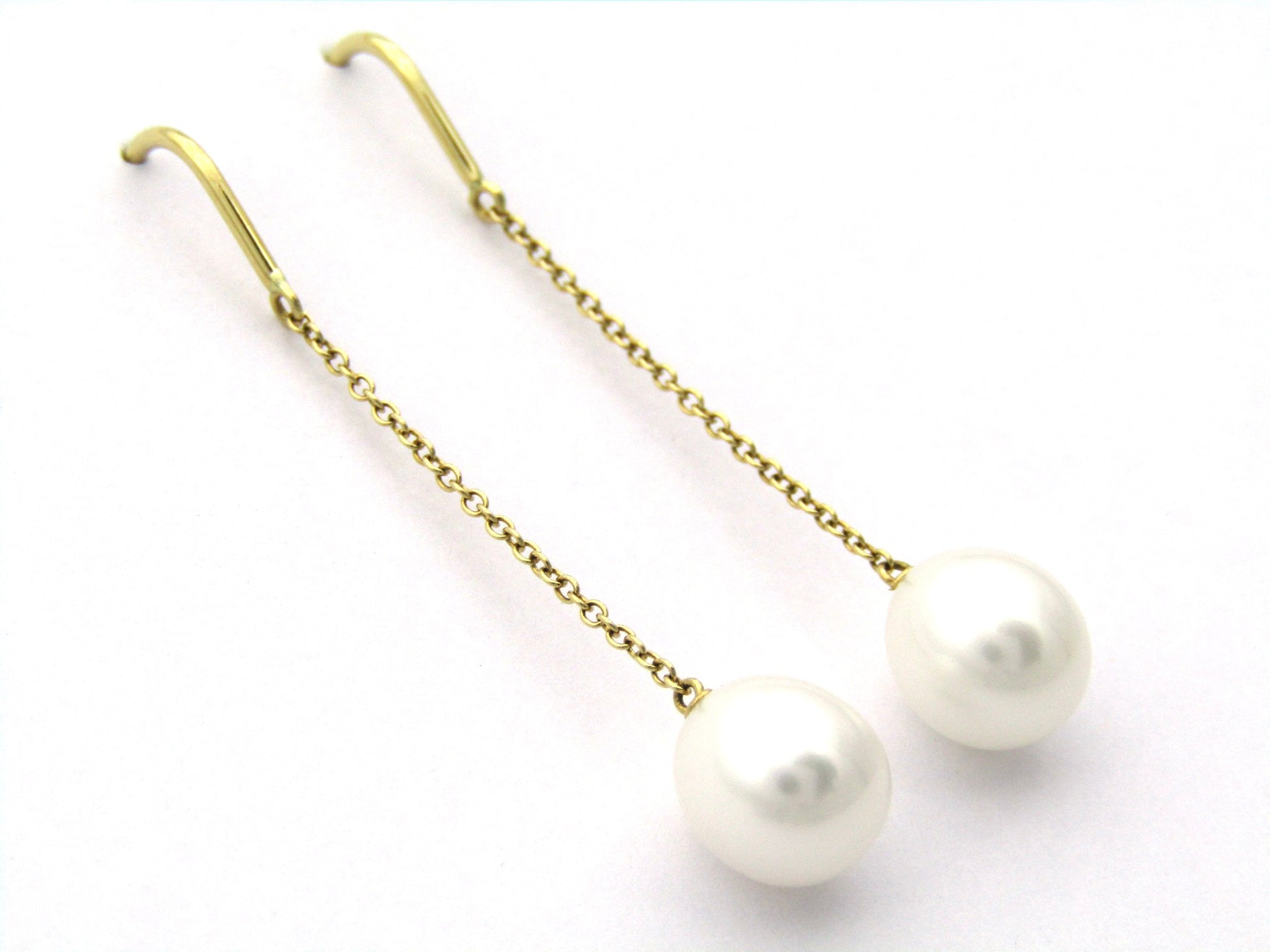 18K gold Tiffany & Co. "Pearls by the Yard" chain earrings.