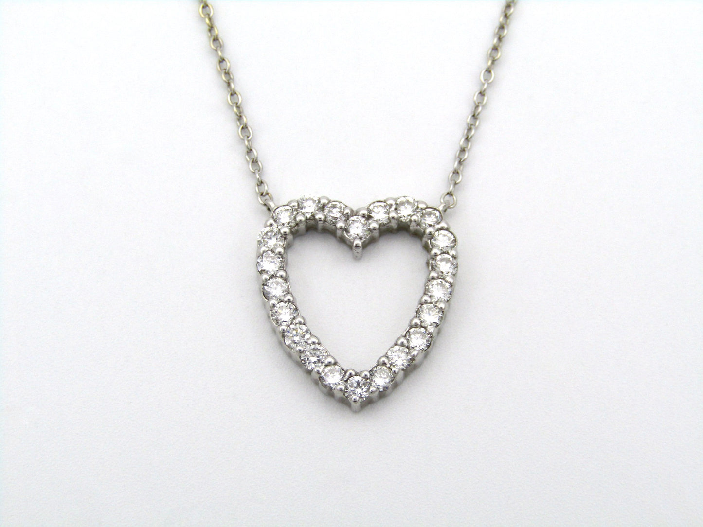 18K gold diamond heart necklace by Browns.