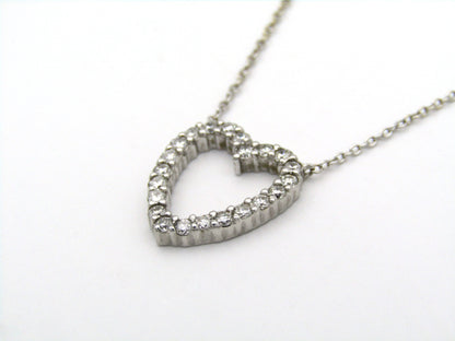 18K gold diamond heart necklace by Browns.