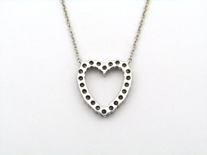 18K gold diamond heart necklace by Browns.