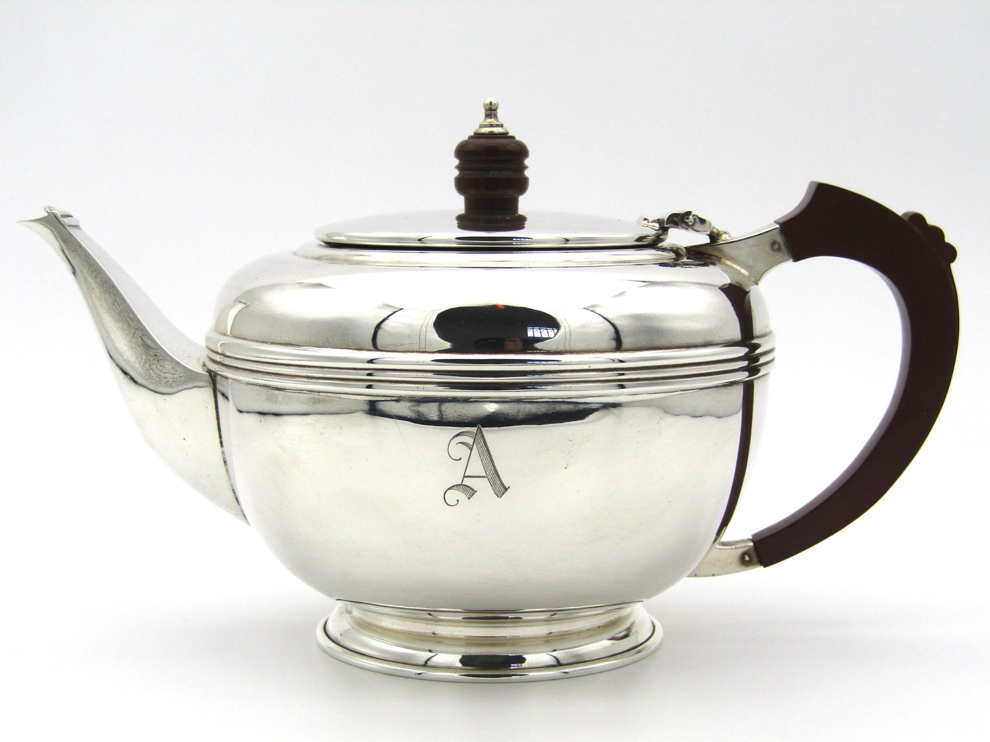 A four piece silver Bachelor tea set by Deacon & Francis, Birmingham, 1958.