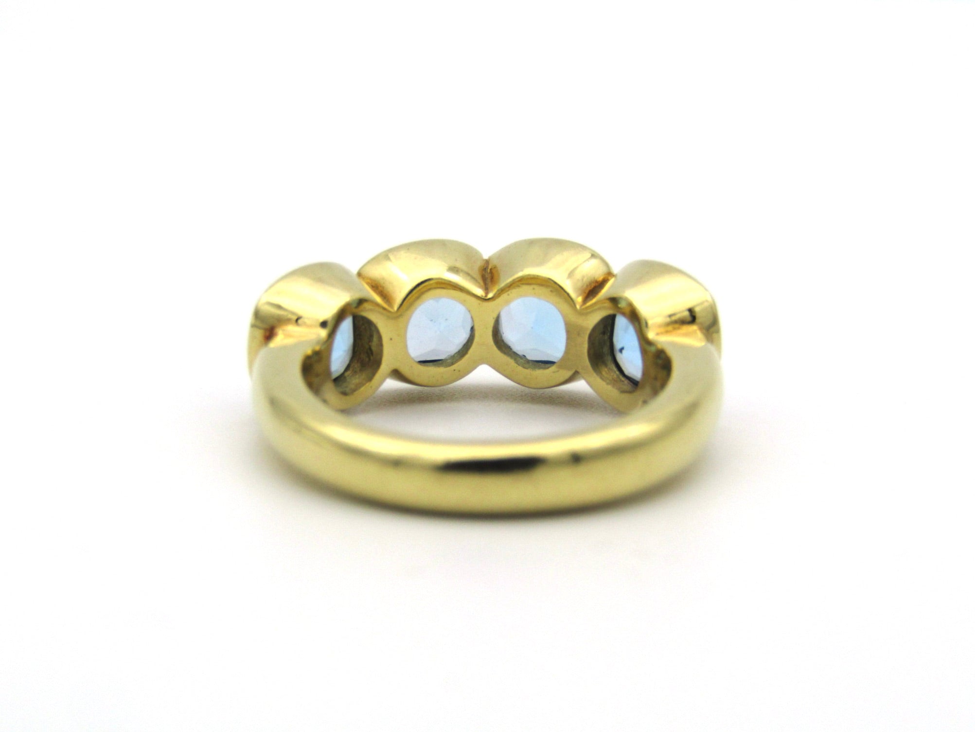 18K gold blue topaz ring.