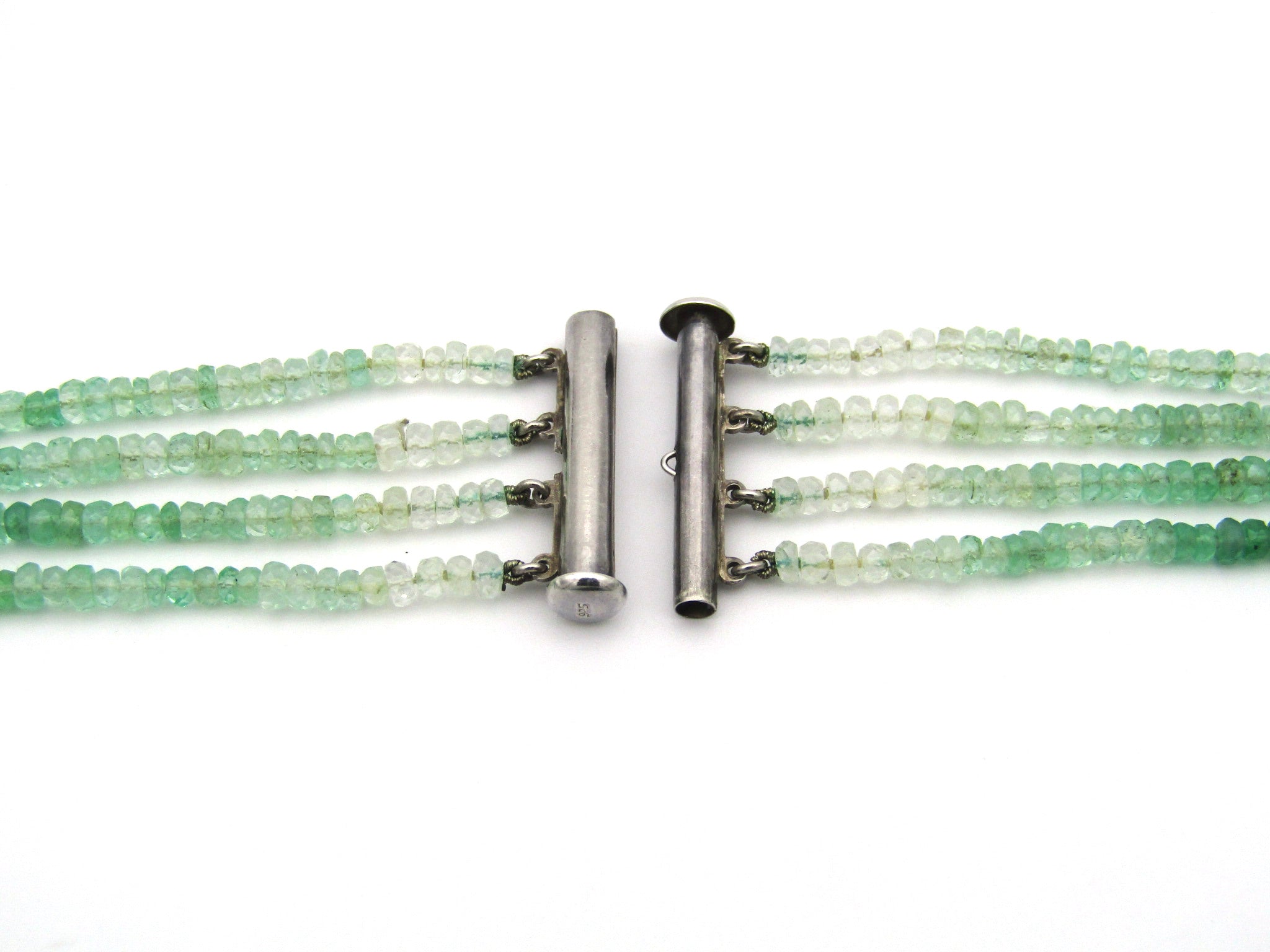 Silver 4-strand emerald and green beryl necklace.