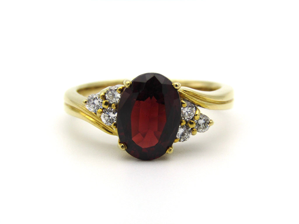 18kt yellow gold garnet and diamond ring.