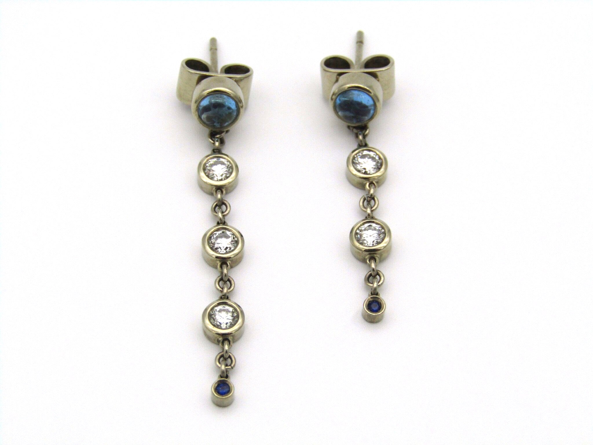 18kt gold diamond and blue topaz earrings by Orpheo.