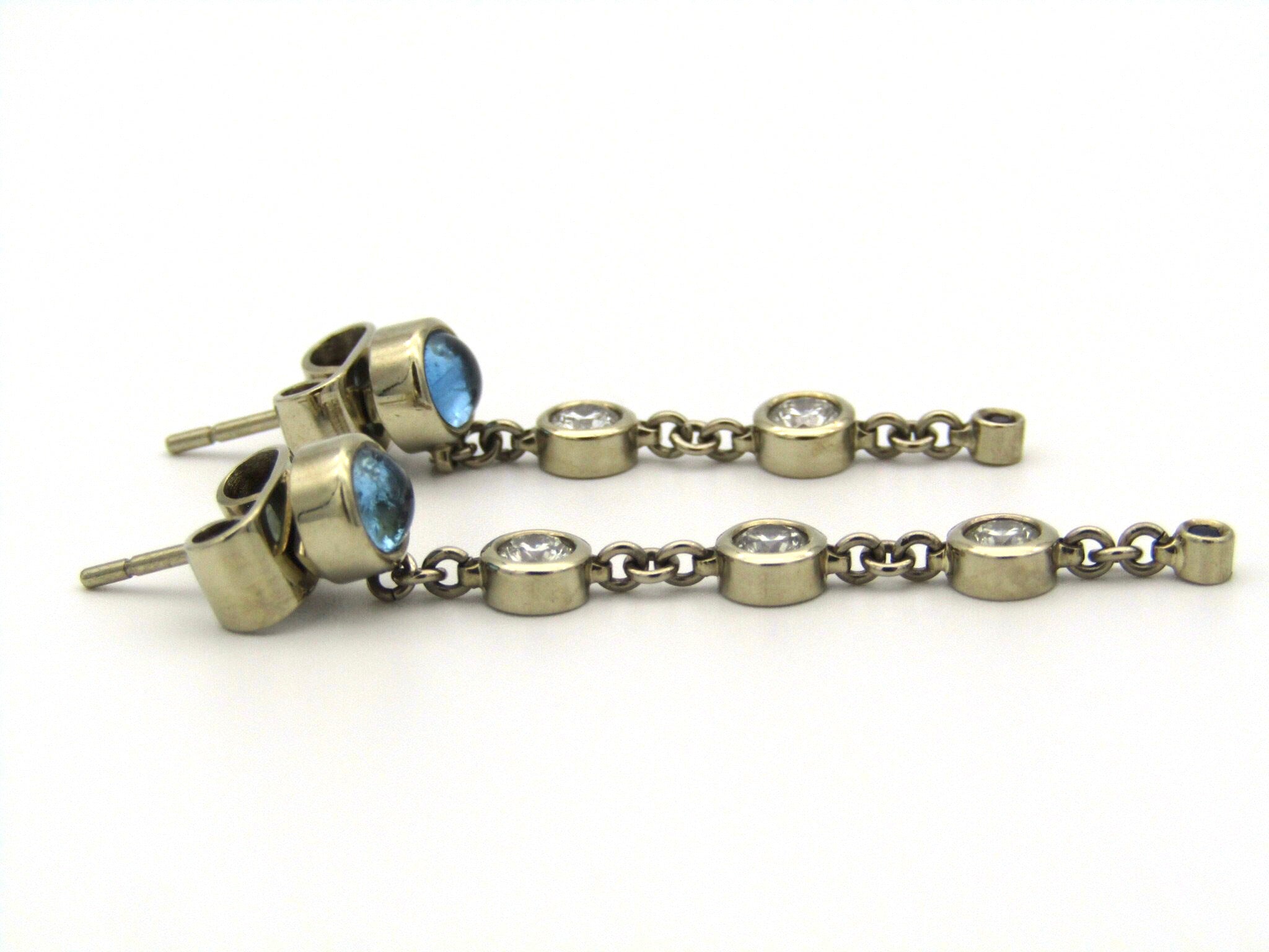 18kt gold diamond and blue topaz earrings by Orpheo.