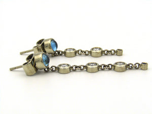 18kt gold diamond and blue topaz earrings by Orpheo.