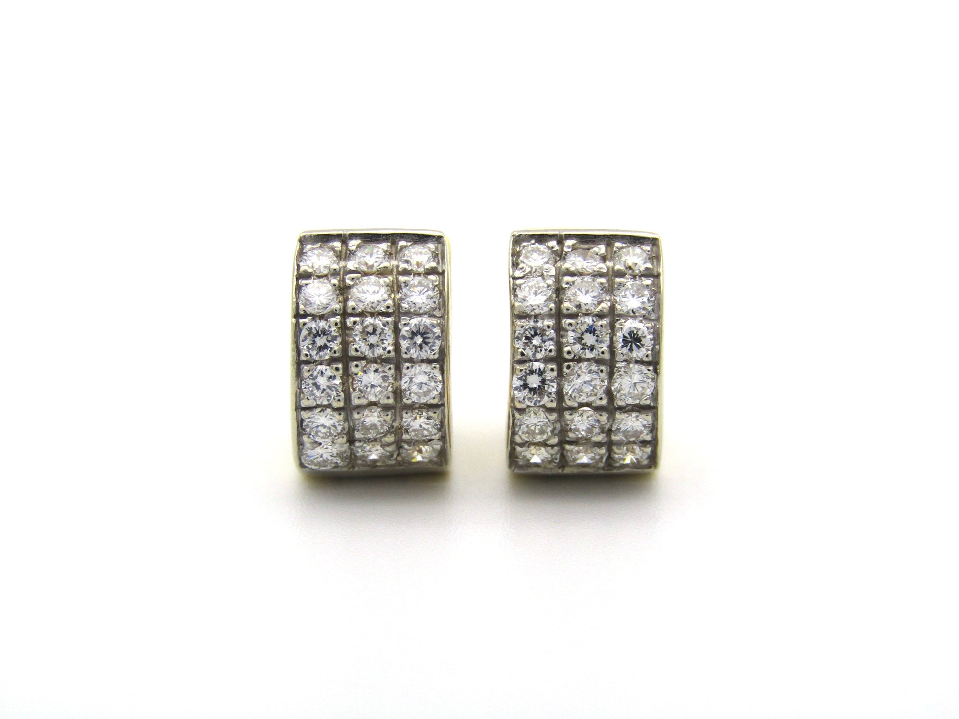 18K gold diamond huggie earrings.