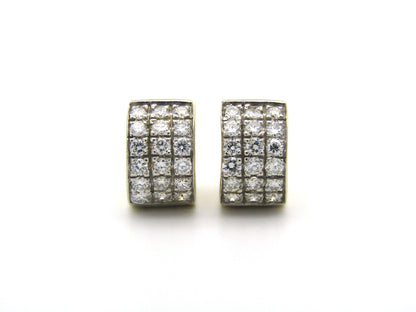 18K gold diamond huggie earrings.