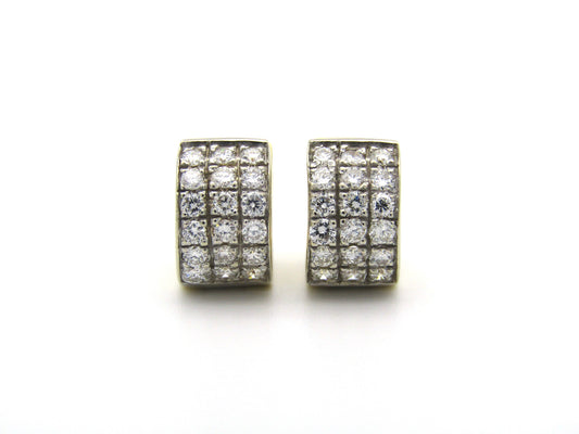 18K gold diamond huggie earrings.