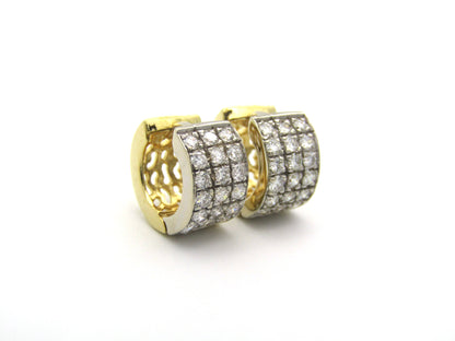 18K gold diamond huggie earrings.