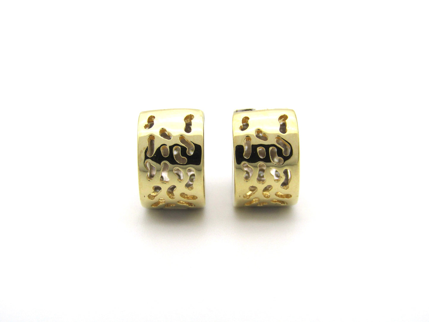 18K gold diamond huggie earrings.