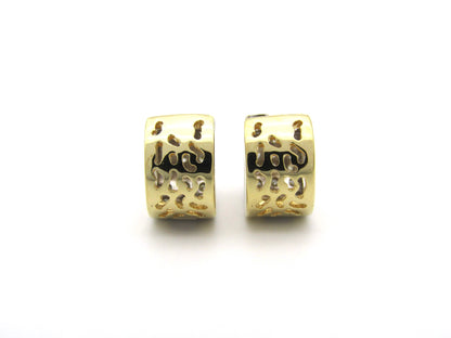 18K gold diamond huggie earrings.