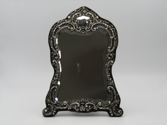 Silver mirror by H. Matthews, made in Birmingham, England, in the year 1902.