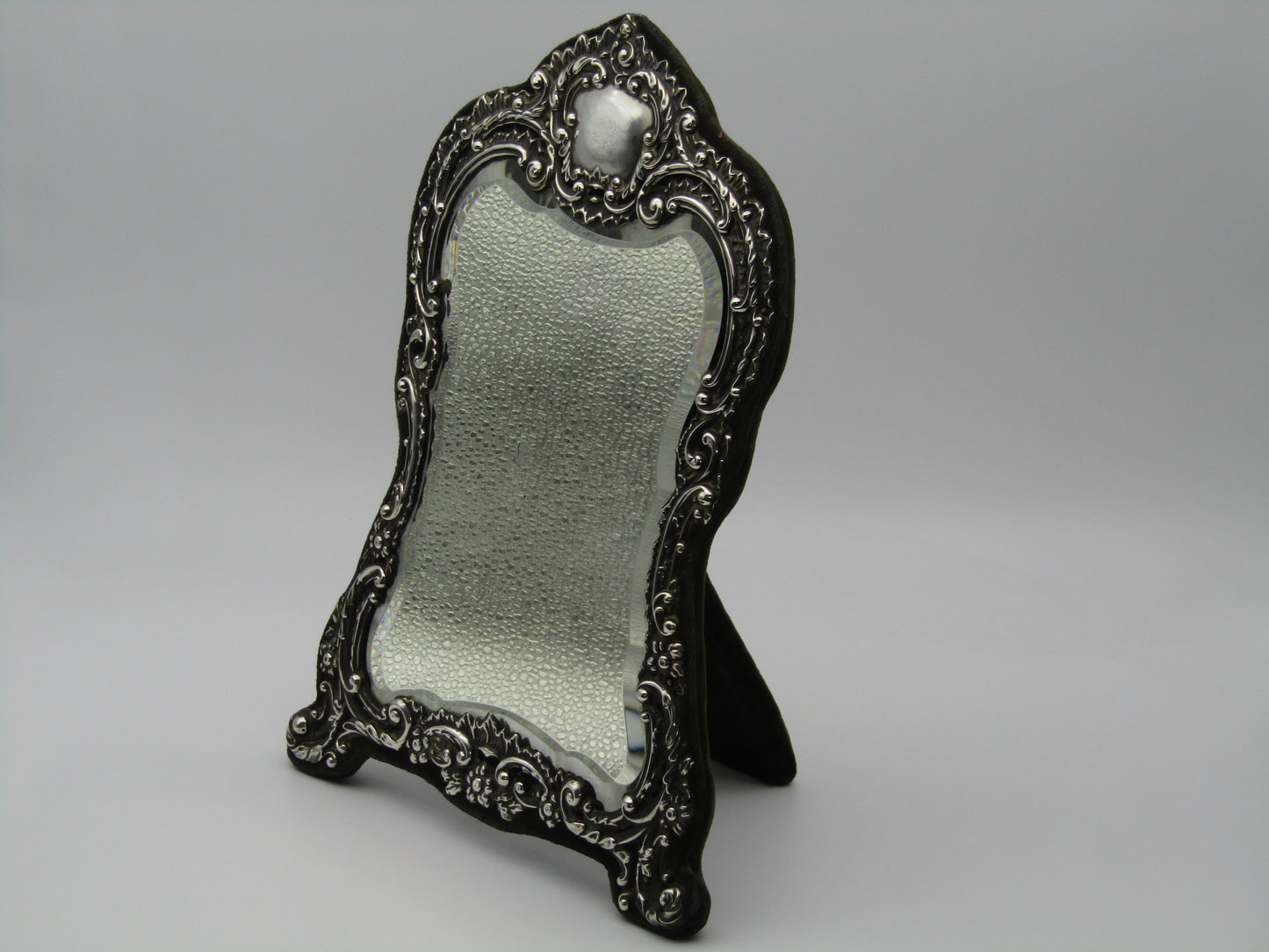 Silver mirror by H. Matthews, made in Birmingham, England, in the year 1902.