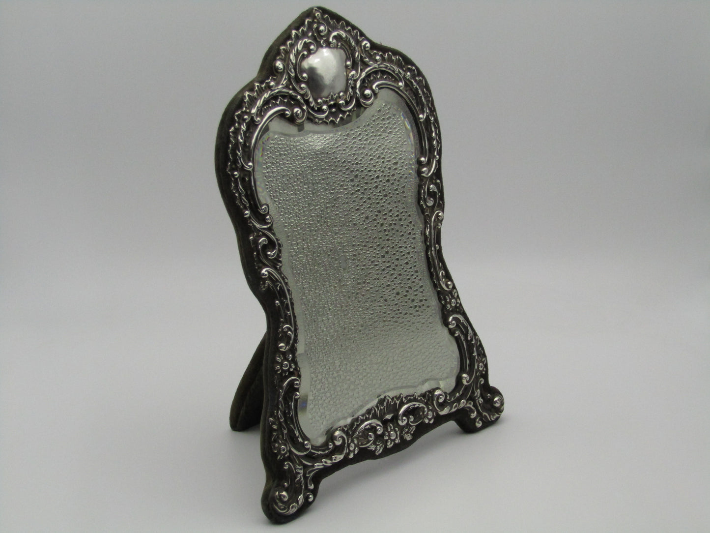 Silver mirror by H. Matthews, made in Birmingham, England, in the year 1902.