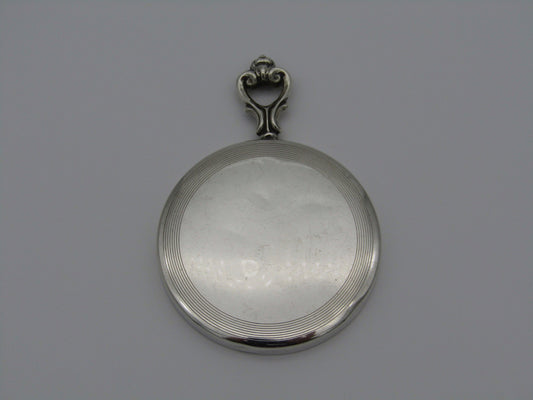 A sterling silver hand mirror by Cartier. Circa 1920s.